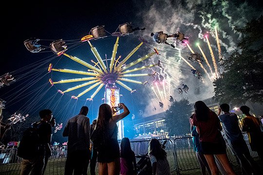 Tulane's tweet photo. In Focus: Carnival time: https://t.co/vRTIGTm6wB A carnival, a pep rally &amp; live music filled everyone with #Tulane pride during #Wave17. https://t.co/Y1ntrtaN1f