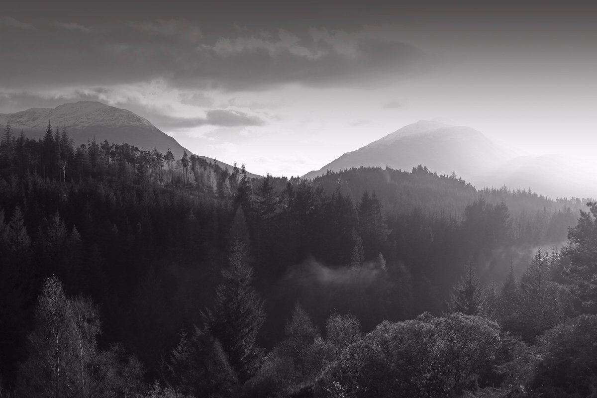 'Last rays' The last rays of the days sunlight shine over the hills and forests above Loch Laggan, Badenoch. #ThePhotoHour #blackandwhite