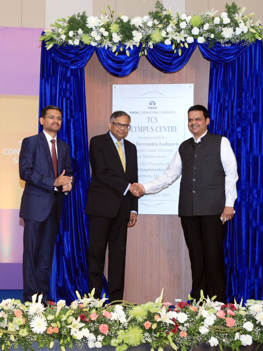 TCS's tweet photo. .@Dev_Fadnavis, the hon'ble CM of Maharashtra, inaugurated #TCSOlympus today. Pictured here is the CM along with CEO Rajesh Gopinathan and Tata Sons' Chairman N. Chandra and #TCSGlimpses of the new office. https://t.co/uGDYkjpV0p