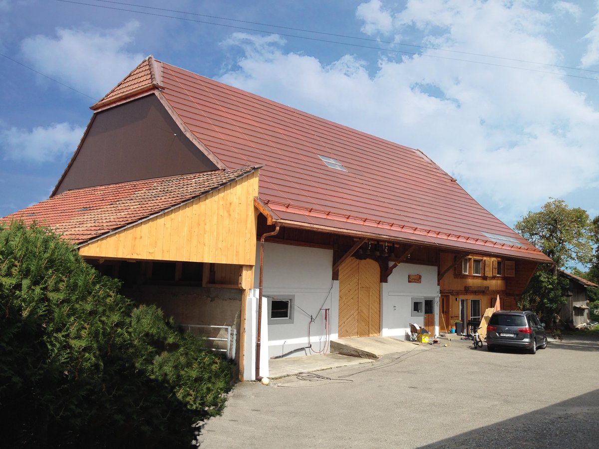 BenBowler80's tweet photo. Terracotta solar panels installed in Fribourg solve visual amenity problem in Swiss protected area https://t.co/6WJ71riPN4. Developed by @CSEM https://t.co/3Mv0Vq6R0w