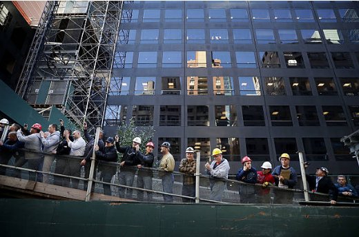 (13) Normal Americans, NYC construction workers, stopped to catch a glimpse of the candidate they probably knew well, who returned a greeting.