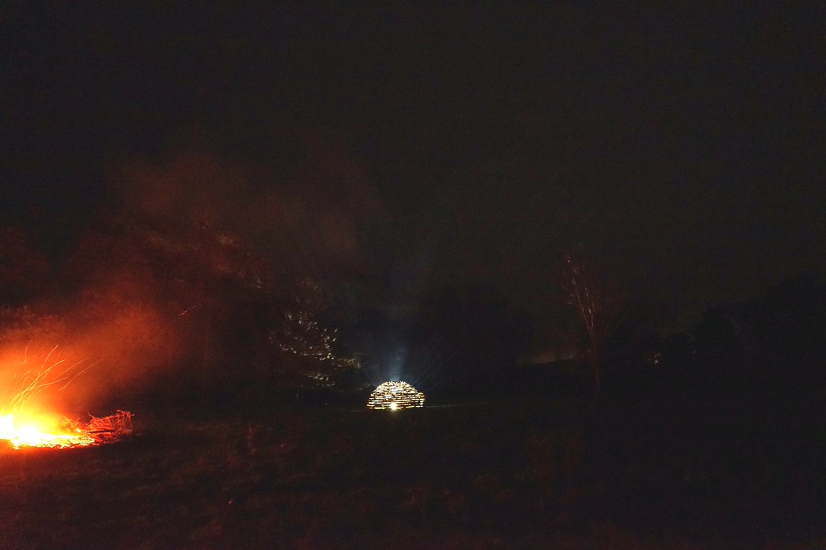 outofnatureshow's tweet photo. Sculptor Richard Harris' photographs of 'Birch' Dome, taken during the artists' closing party at @outofnatureshow - Smoke blowing across from 'Bonfire' reveals the beams of light, emanating from 'Birch'. https://t.co/cjY3r7RV5K