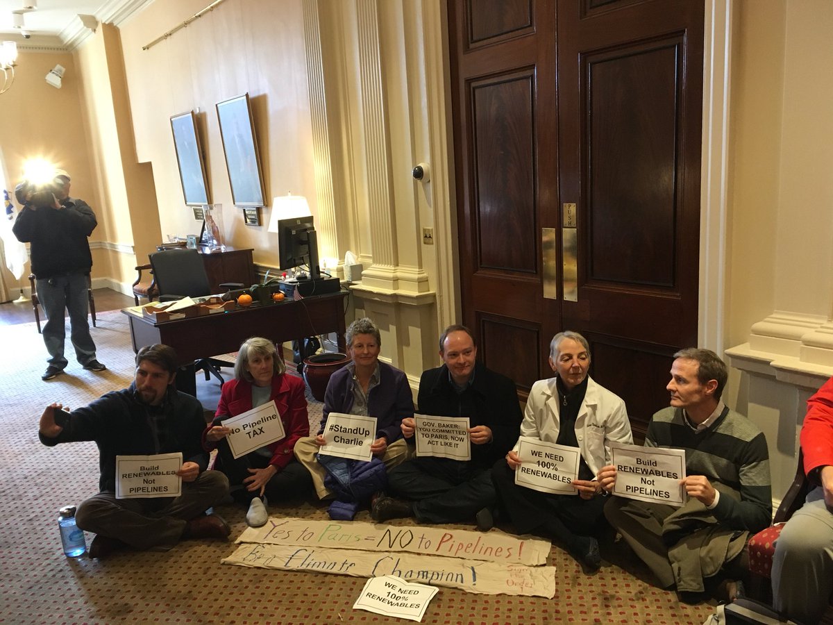 350MassAct's tweet photo. Breaking: MA residents sitting in at @MassGovernor’s office to demand that Gov. Baker say no to new fossil fuel infrastructure #StandUpCharlie #COP23 https://t.co/b770vRU7rd