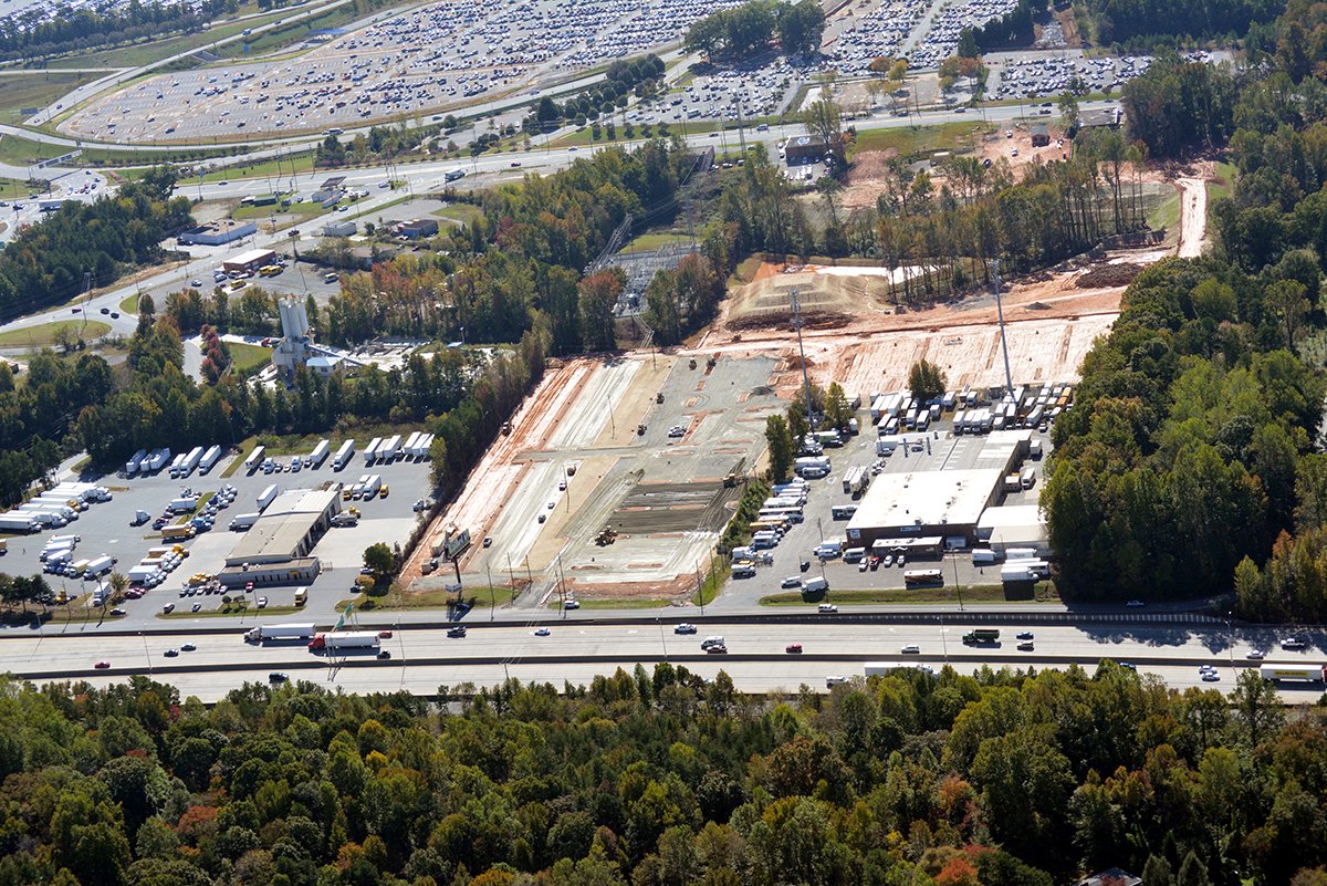 EdificeConst's tweet image. Project Update | @theParkingSpot #Clt Paving underway, bldg interior walls complete, landscaping on the horizon @StewartInc