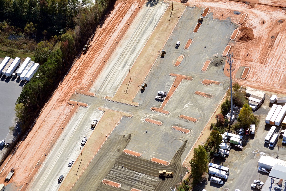 EdificeConst's tweet image. Project Update | @theParkingSpot #Clt Paving underway, bldg interior walls complete, landscaping on the horizon @StewartInc