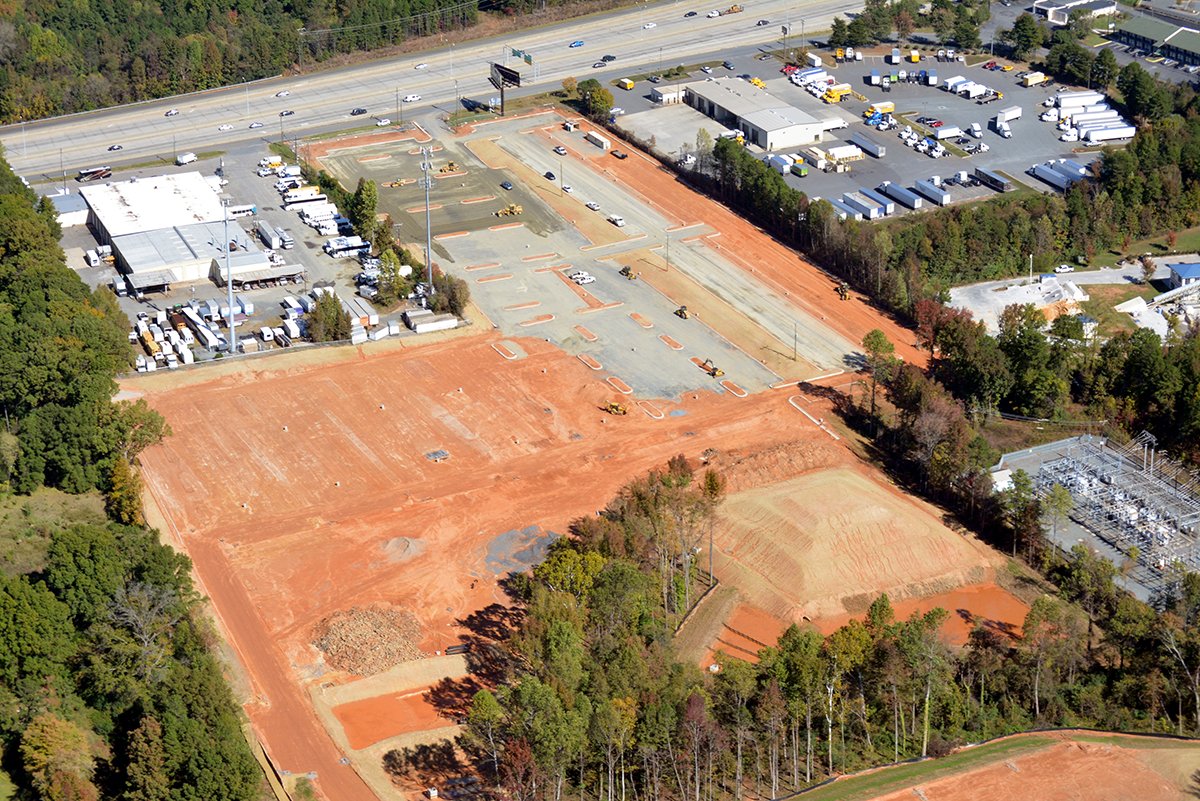 EdificeConst's tweet image. Project Update | @theParkingSpot #Clt Paving underway, bldg interior walls complete, landscaping on the horizon @StewartInc