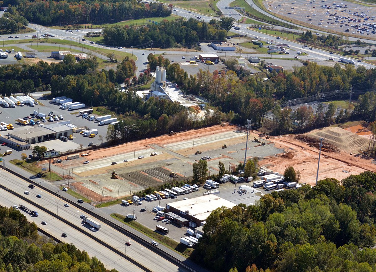 EdificeConst's tweet image. Project Update | @theParkingSpot #Clt Paving underway, bldg interior walls complete, landscaping on the horizon @StewartInc