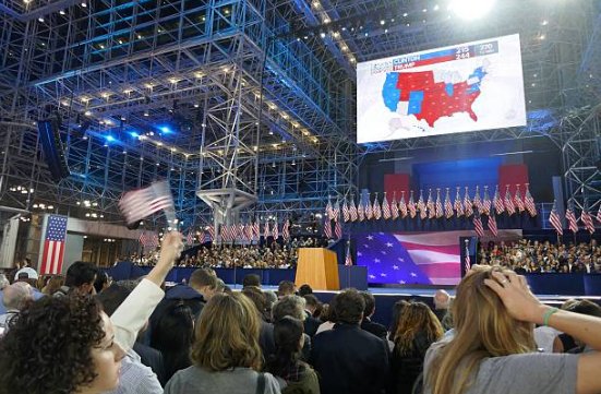 (45) Just one Hillary supporter raising the flag while everyone else is taking in all that glorious red on the electoral map. Not sure why.