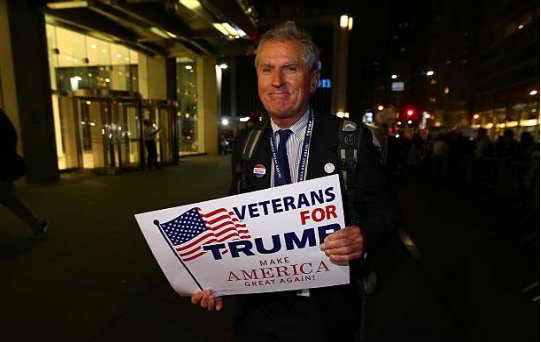 (52) Before we look at photos of Hillary's eventual 10am concession speech, here are some more Trump voters. The family were walking past Hillary's Scooby Van parked outside her hotel.