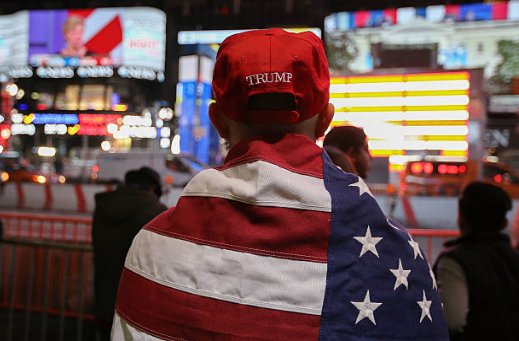 (52) Before we look at photos of Hillary's eventual 10am concession speech, here are some more Trump voters. The family were walking past Hillary's Scooby Van parked outside her hotel.