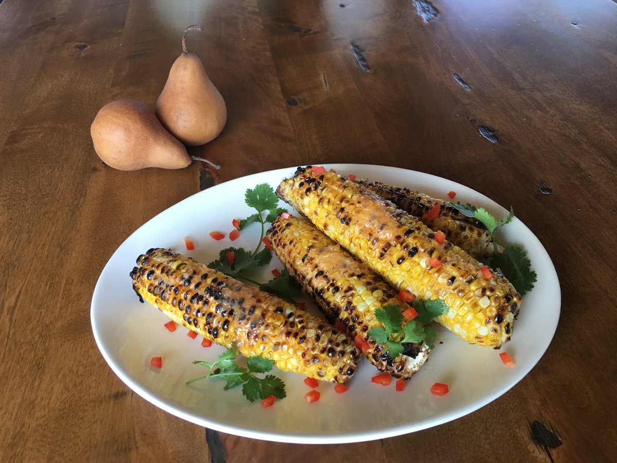 Having one last summer fling-corn on the cob done stove top.Seared in a cast iron frying pan made even better with Pineapple Sriracha Butter