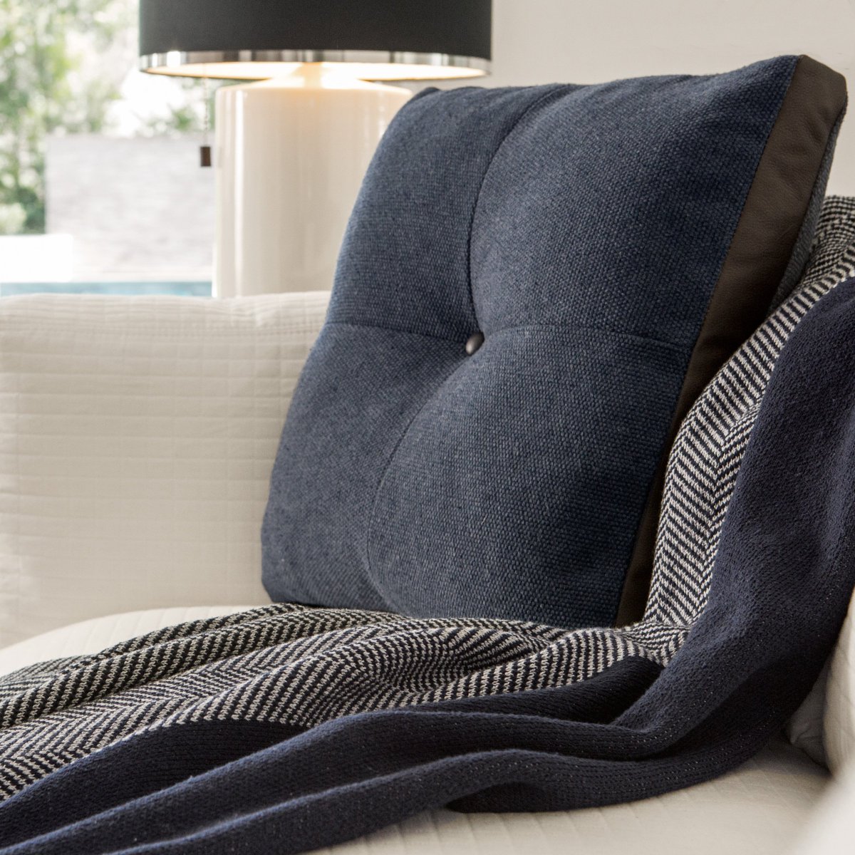 PENNINGTON-a  square bolster made of a 100% cotton fabric woven in Pennsylvania. The  details of a leather button tuft and box edge provide a note of  sophistication. ADDISON-a throw woven of recycled cotton in New York.  Made in USA! Sustainable. 
valoramericanhome.com/shop/softgoods