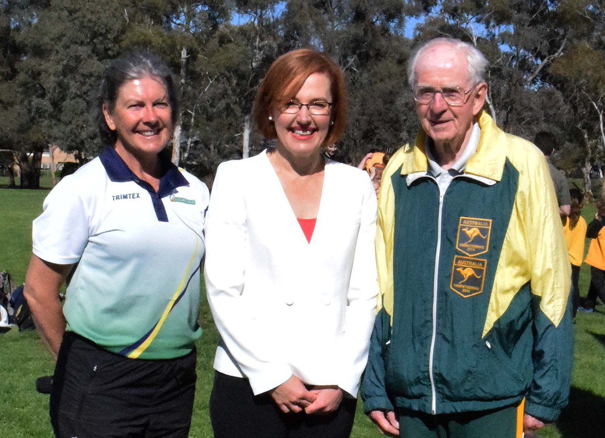 OrienteeringACT's tweet image. Toni Brown with @MeeganFitzMLA and 93-yrold Hermnann Wehner at 4th and final event in @scoreACT Spring Series  (140 students) at St Thomas More’s Primary School Campbell