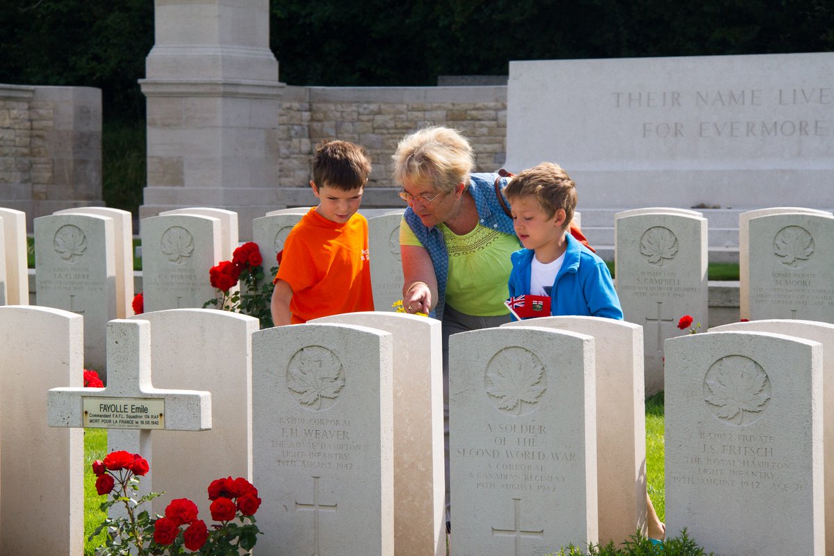 GlblCanuck's tweet photo. 11 Days of Remembrance
Day 9: A symbol or act of Remembrance
#CanadaRemembers @VeteransENG_CA
French grandmother teaching her grandson & his friend about cemeteries & Canada’s sacrifices for Dieppe at Dieppe Canadian War Cemetery. @CWGC @JunoBeachCentre #juno14 https://t.co/wo7hmpEDRB