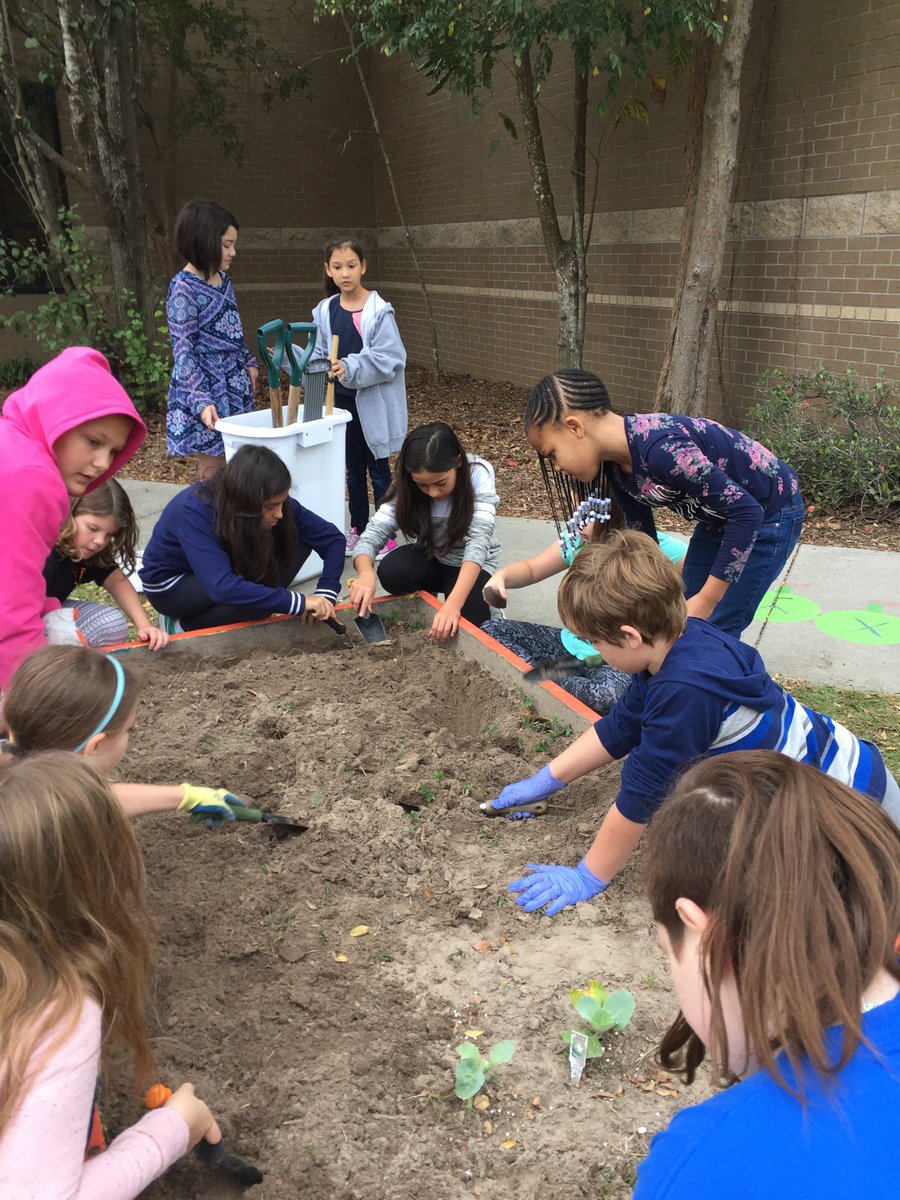 EGE Garden Club hard at work with extra help from friendly volunteers.