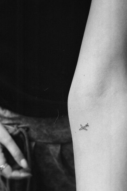 Tattoo uploaded by Mandira Tattoo & Art • Airplane minimal tattoo. Ankle,  foot • Tattoodo