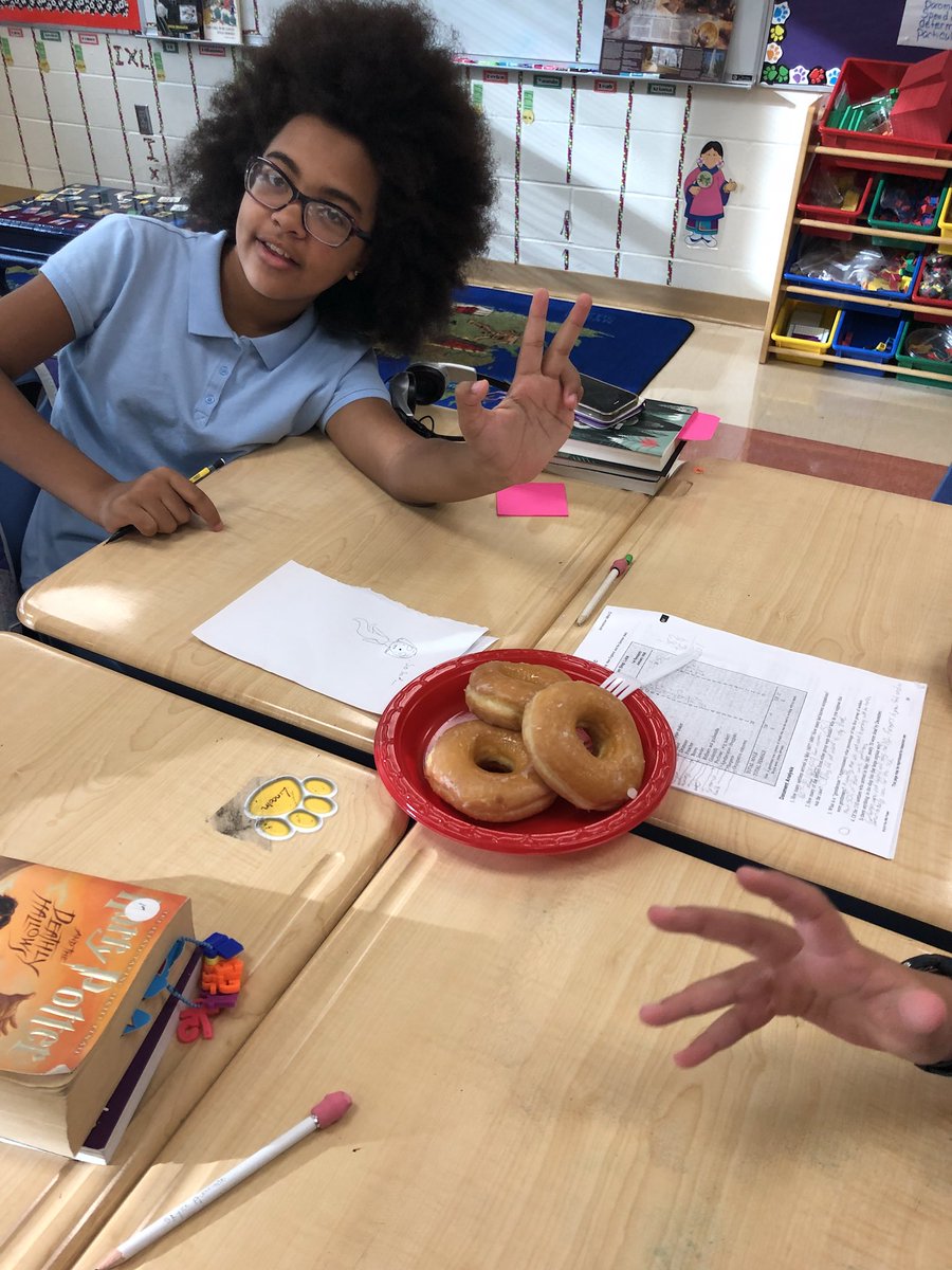 JulieReheiser's tweet photo. Talk about motivation. Using donuts as manipulative for relating fractions and division. @CESWildcats #donutmath #VCSMath https://t.co/svg5oJJZUd