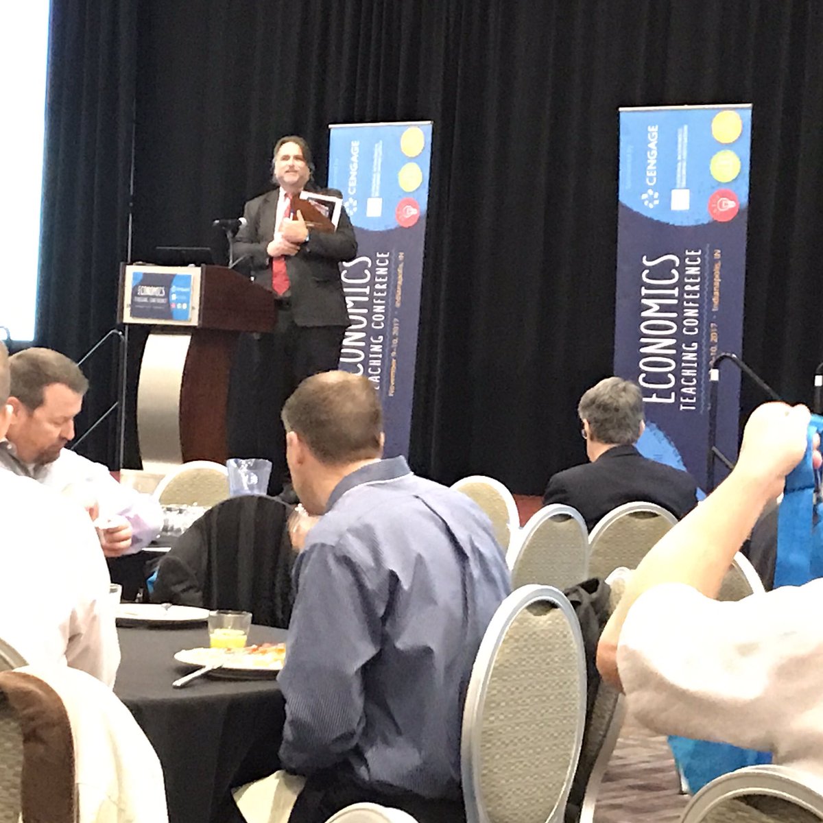 cubegrl's tweet photo. John Carey welcoming economics educators to #NETA17 @CengageEcon https://t.co/NIc2ajUeEB
