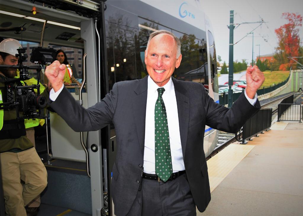 unccharlotte's tweet photo. Chancellor Dubois celebrates his first light rail test ride - we've got the latest updates including when it arrives on campus. https://t.co/mAukaC6e3R https://t.co/33CDs0qsf6