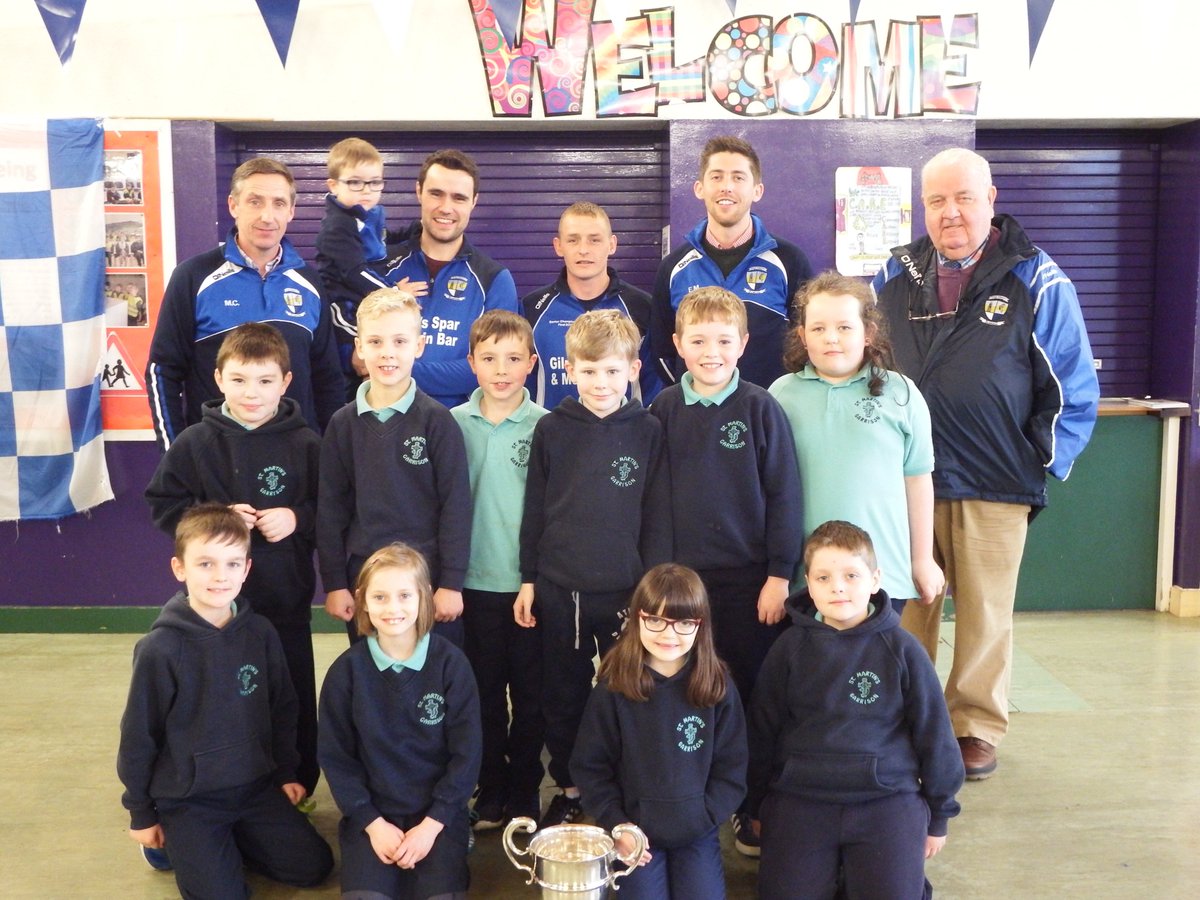 StMartinsPS's tweet photo. Some of the @DevenishGAA Senior Men's team visited yesterday with the Division 1 League Cup. Thanks to Terry, Martin, Eoghan, Malachy and Peter for sharing their success with us. A great achievement in Centenary year. #Devenish100 https://t.co/ZkY3AuwtCJ