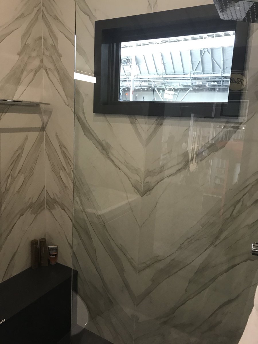 D_O_G's tweet photo. @Neolith_ creates an awesome shower surround with minimal grout lines! 
#designer #greenbuild17 https://t.co/x3QZr6DjTY