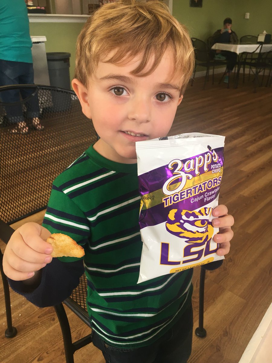 RobbynBTaylor's tweet photo. Brooks devouring #Tigertators like @TroyTrojansFB ate up @LSUfootball after he proudly informed everyone at #davidssnoballs that Troy beat LSU. #OneTROY @TroyAthletics #RTW #troyuspirit @tayloaf @jtchunn038 https://t.co/oZpCIQn8bf