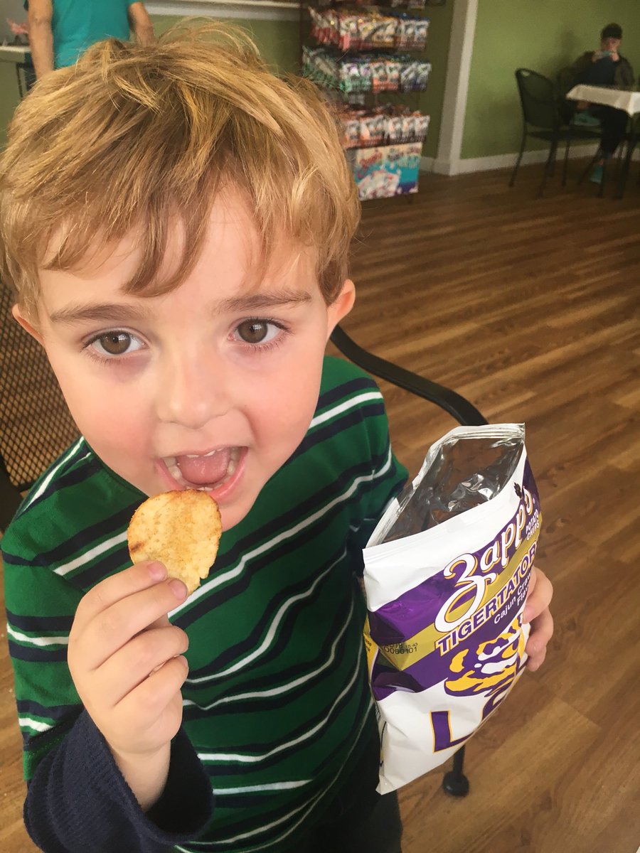 RobbynBTaylor's tweet photo. Brooks devouring #Tigertators like @TroyTrojansFB ate up @LSUfootball after he proudly informed everyone at #davidssnoballs that Troy beat LSU. #OneTROY @TroyAthletics #RTW #troyuspirit @tayloaf @jtchunn038 https://t.co/oZpCIQn8bf