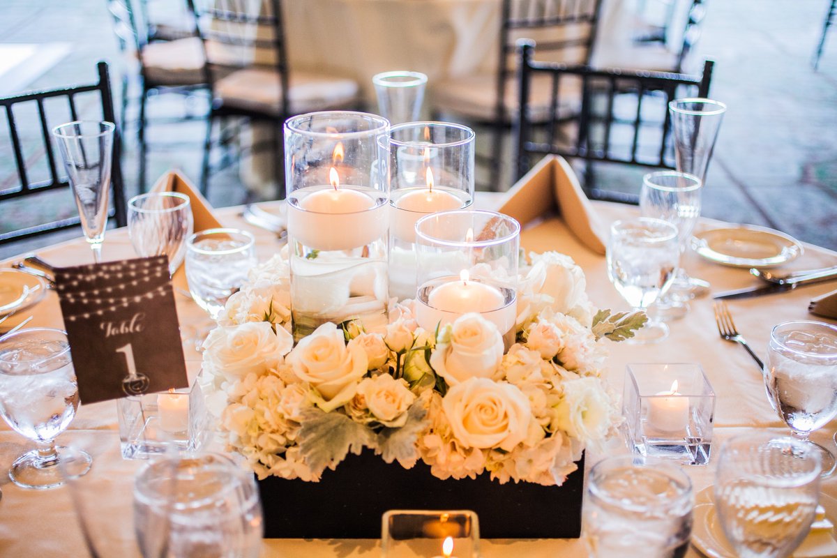 The lit candles add warmth and dimension to this amazing table top arrangement  @ PVGC
