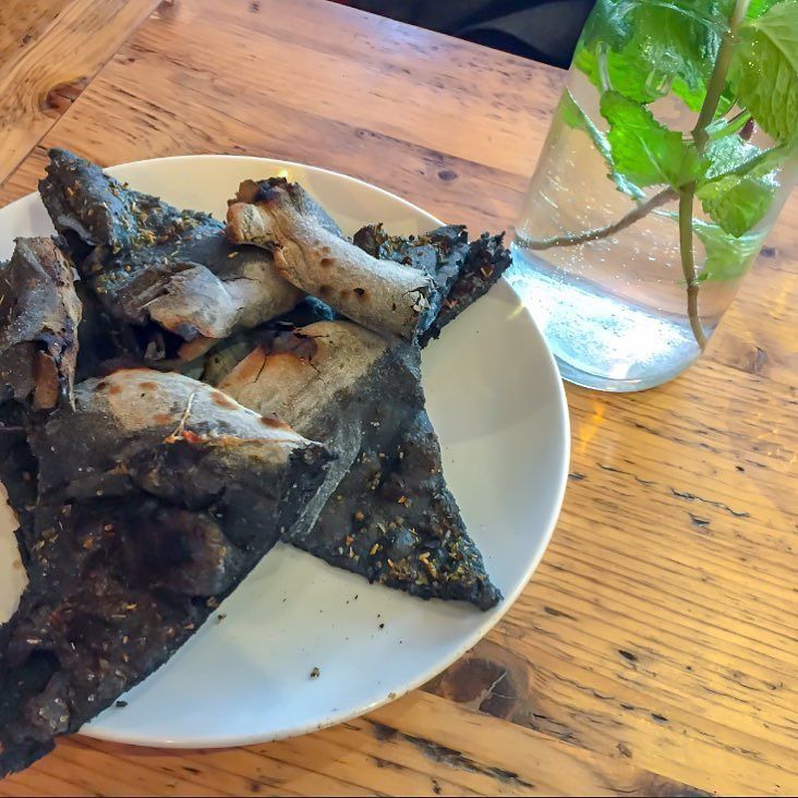 BFinLondon's tweet photo. You are probably “wth is this”? Don’t get deceived by the looks! This is probably one of the best #foccacia in the area! Made of #charchoal… https://t.co/P8gWV8qGJC