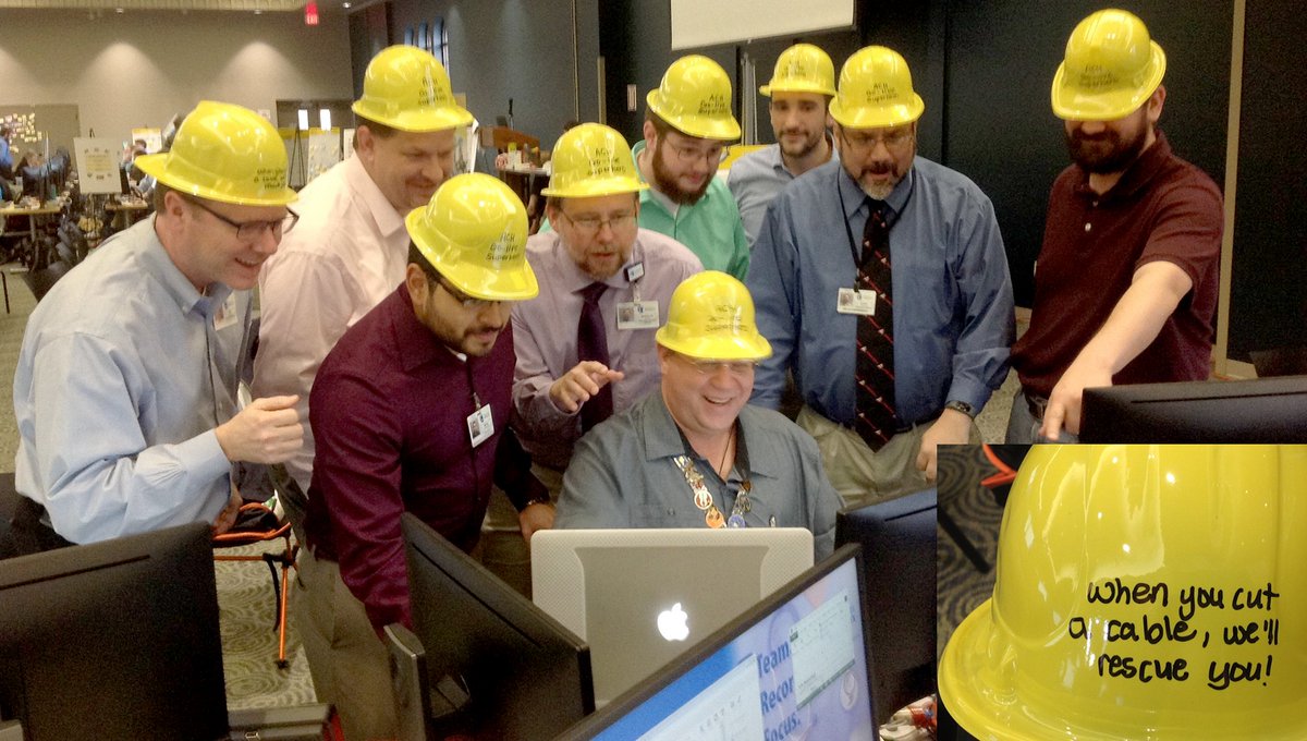 This group was among those who helped get us back going again after one of our data cables got cut last night. We presented them with yellow construction hats that say "When you cut a cable, we'll rescue you!" Thanks guys. #CallBeforeYouDig #GoLiveHeroes