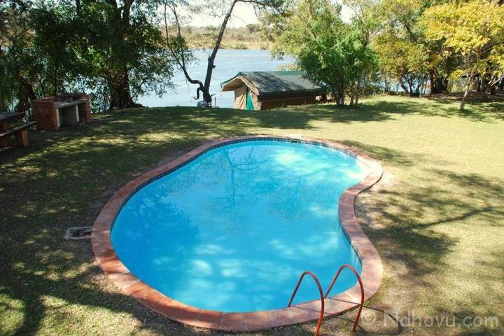 Ndhovu Safari Lodge, situated 20 km southeast of the Divundu Bridge, just behind the Popa Falls. Activities – Boat cruises, Mahango & Buffalo Game drives & village tours. Bar, restaurant & swimming pool facilities. #ViewsFromThe066