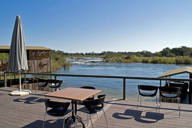 Popa Falls Resort (under NWR), situated 194 km East of Rundu in the Divindu area. Activities – Game Drives & Boat Cruises. Restaurant, Bar, Tourist Shop, Jetty Bar, & Swimming Pool facilities.  #ViewsFromThe066