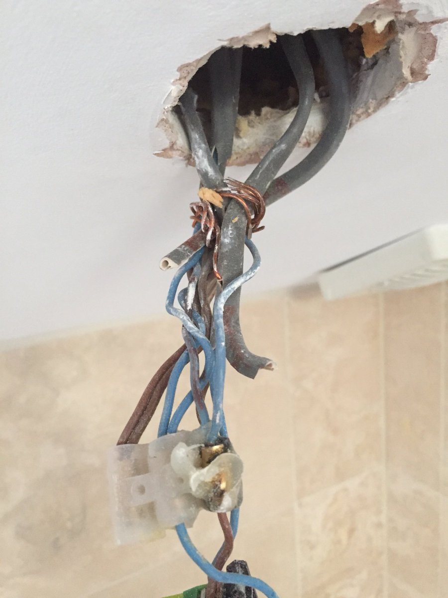 C4HElectric's tweet photo. Bathroom downlights installed 9 years ago by builders “Electrician”. @OfficialNAPIT @ElecSafetyFirst #PartP and it’s #FalseTeeth https://t.co/RRrgvzcdBV