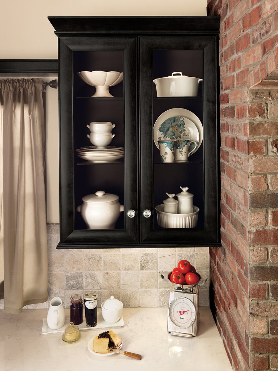 Designer Tip: Incorporating glass cabinets with matching interiors in your kitchen is a great way to display your dishes and accessories.