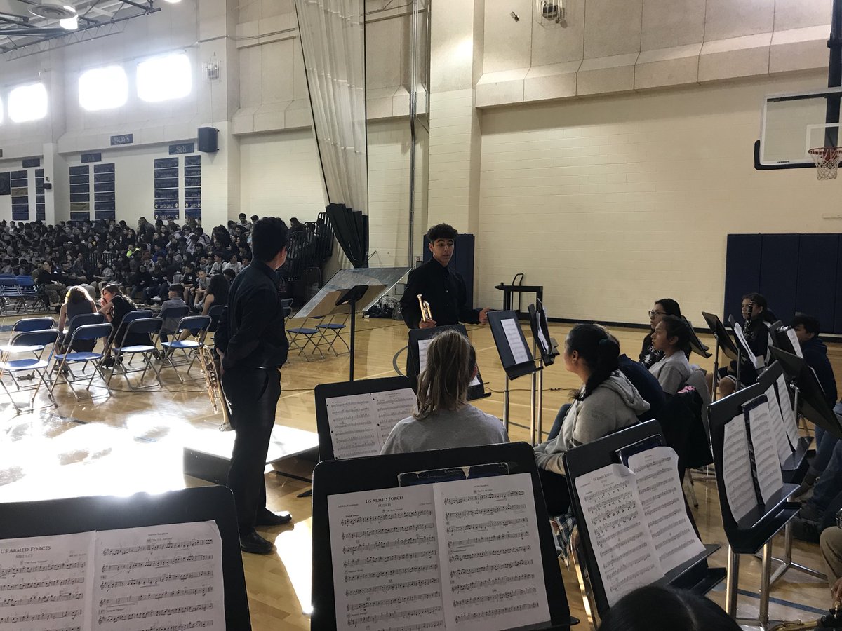AkinsEagleBand's tweet photo. Aymane and Noah take questions from our #AEBFuture students at Paredes MS during their Veterans Day event. https://t.co/2s7b10uTB7