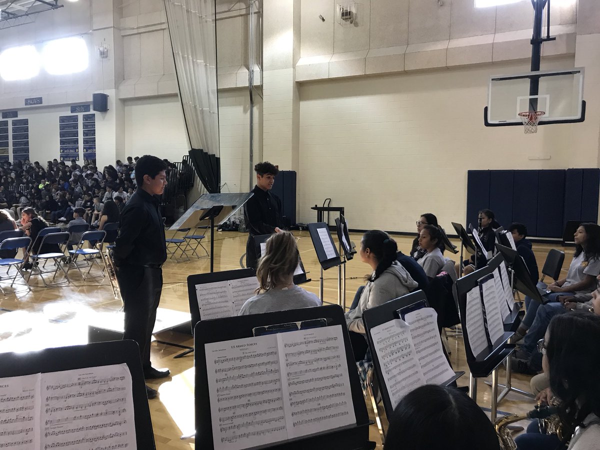 AkinsEagleBand's tweet photo. Aymane and Noah take questions from our #AEBFuture students at Paredes MS during their Veterans Day event. https://t.co/2s7b10uTB7