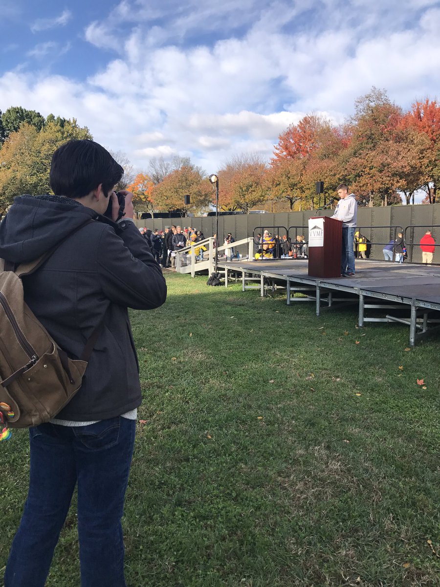 HHarbinger's tweet photo. Ethan Scott ('19) reads names of fallen service men at the Vietnam Veterans Memorial for the For Our Troops Club trip. https://t.co/XFIc0s9BlU