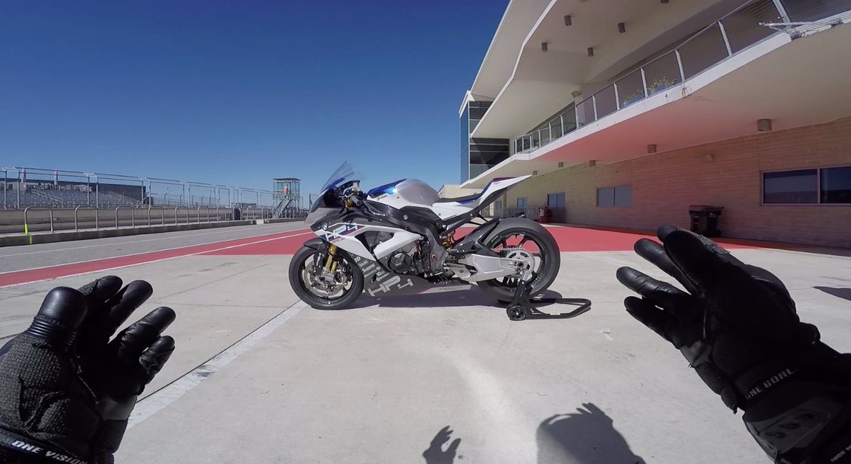MotorcyclistMag's tweet photo. ONBOARD VIDEO! Imagine a bike that can wheelie over backward at the top of 5th gear. #BMW built it, and let us loose at Circuit of The Americas. Buckle up before you click this link: https://t.co/KUXhuW7BiY https://t.co/Ndehi7swGq