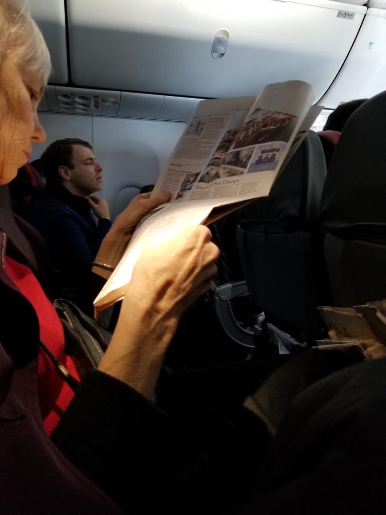 SQL412's tweet photo. Who reads a newspaper on an airplane in the middle seat!?  #whatnottodo #roadwarriorproblems #bringabook #ihopeshefindshappiness https://t.co/8uHkTYAK2Z