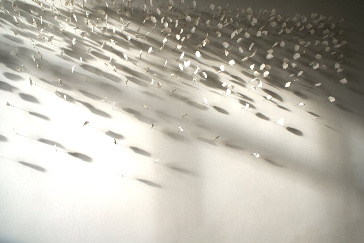 Arthouse1London's tweet photo. Caught in the morning light - 'Accumulate' by @janeponsford Thousands of fragments of paper cast onto pins. 
Breath taking. And if you look real close you can just see traces from @susanefrancis and @fiona_grady recent works on this same wall. https://t.co/EW3mGMVdYo