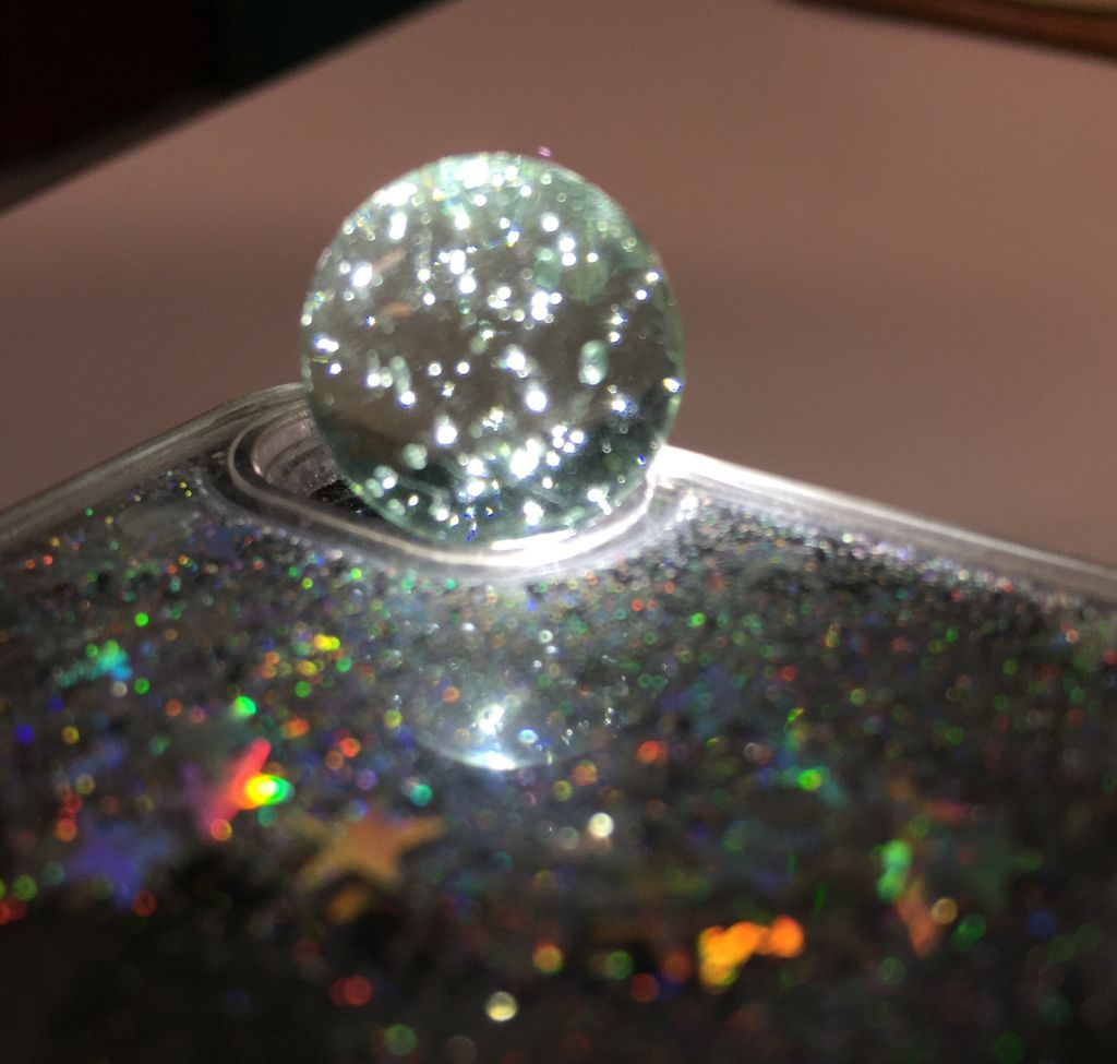 MakerLabNW's tweet photo. A clear #marble on a cell phone flash makes a tiny galaxy. ❤️ #makerlabnw #tinygalaxy #kidsdiscoveringthings https://t.co/2vwVj4okvR