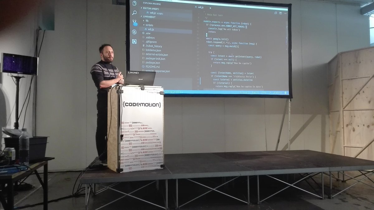 LinkMeJS's tweet photo. Our tech lead @lambrojos speaking at #codemotion.. can a chatbot learn how to send you in vacation? #convcomp2017 #chatbotextravaganza https://t.co/QANvBUUpDD