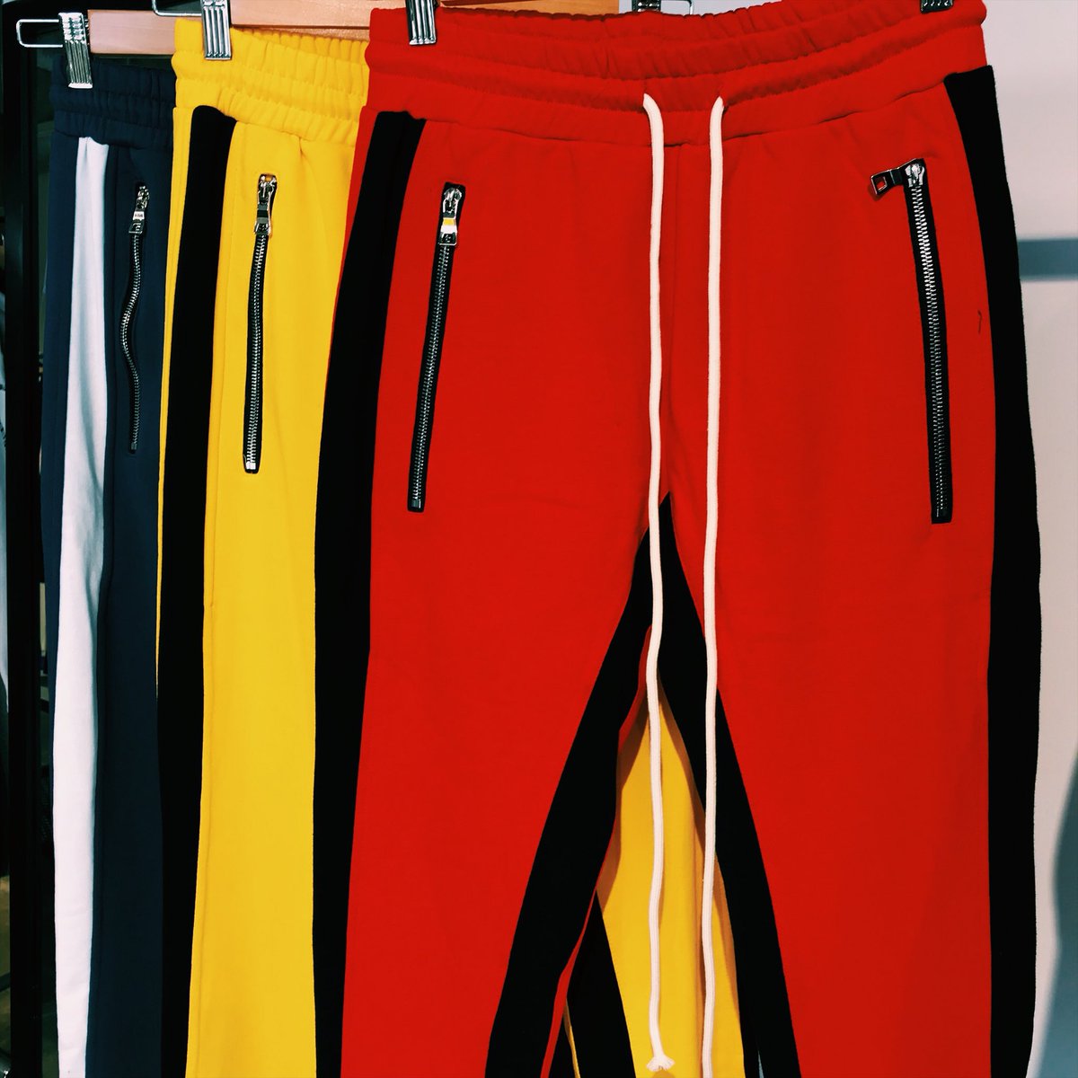 red and yellow track pants