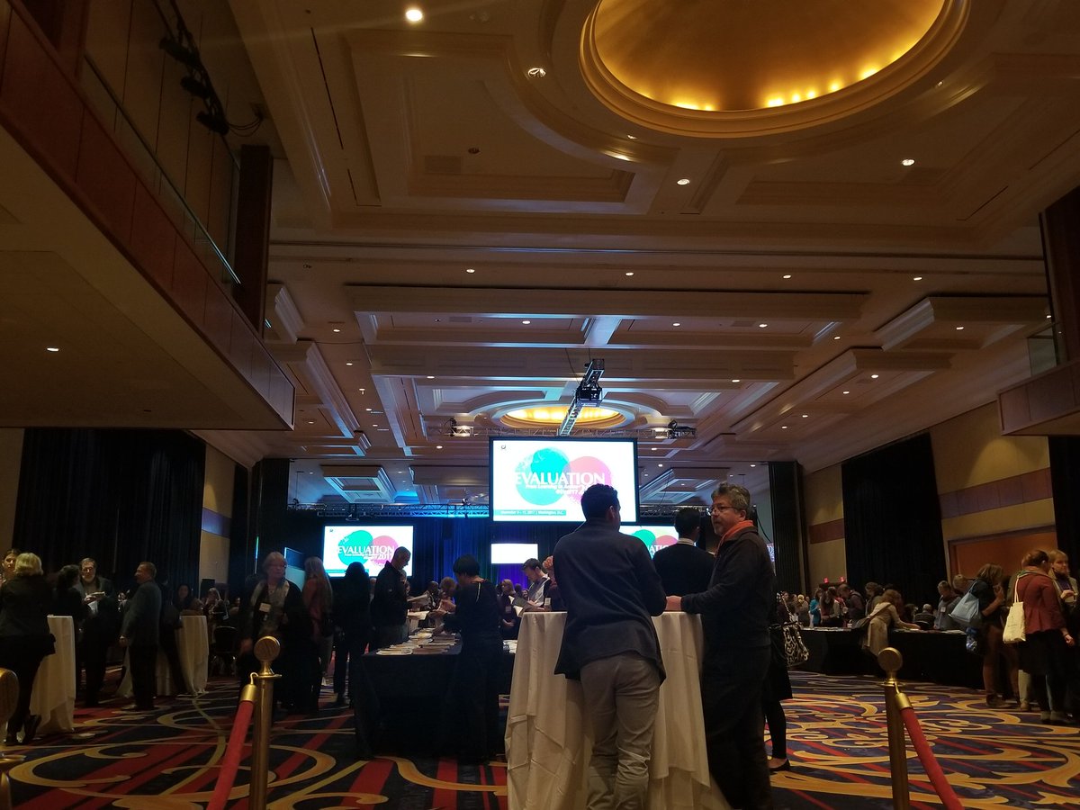 EvalGeek's tweet photo. Chatting away at the Reception & Silent Auction at AEA #Eval17 #eval2017 https://t.co/1INbAcTPKb