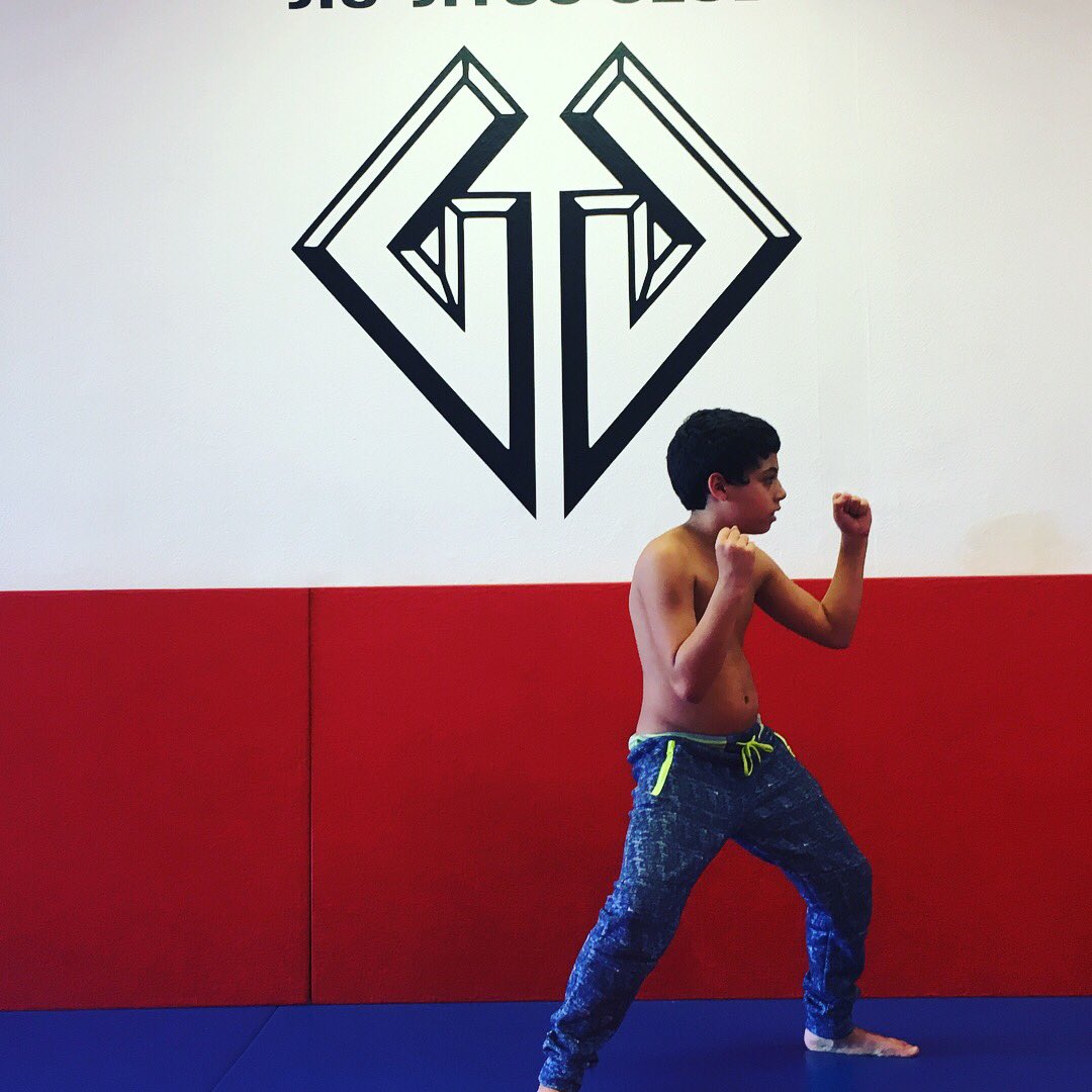 GoesJiu's tweet photo. This is Kyle Goés practicing his striking pose with guidance from his father, Master Góes. Kyle practices Jiu Jitsu every week to keep his mind focused so that he might overcome the many challenges he faces. https://t.co/YZgvlyyD98