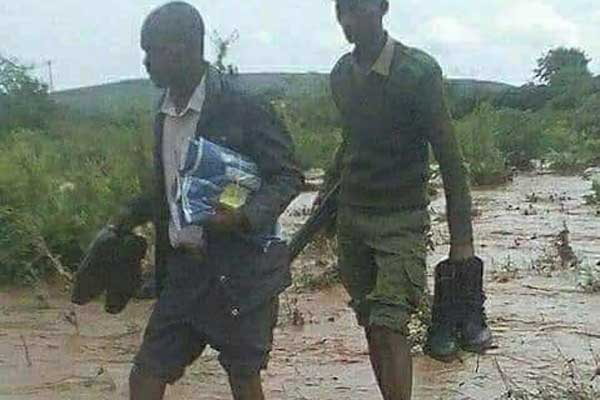 Matiang’i wants teacher, officer who braved floods to deliver exam honoured bit.ly/2hrBIBR