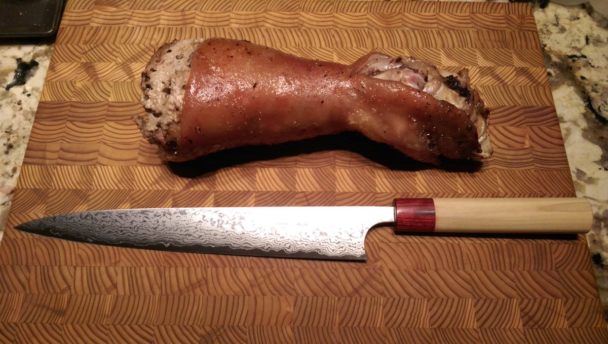 .<a href="/AndyTheButcher_/">Andrew Muckleston</a> potato-and-leek sausage-stuffed pig's foot, on @Knifewear larch cutting board with Masakage "flesh slicer". Could I be any classier?