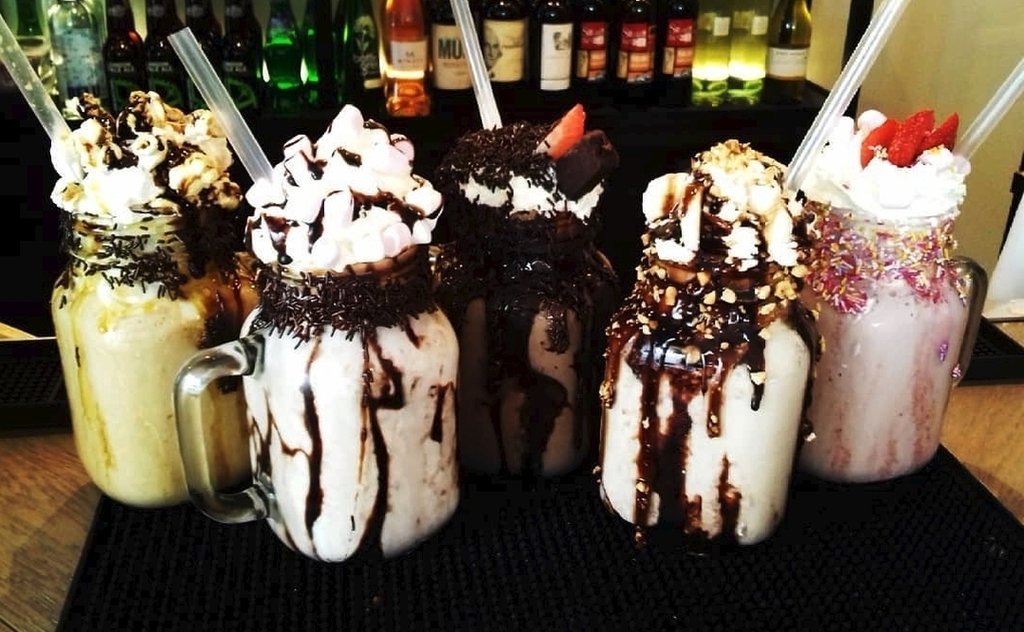 BRGRCOUK's tweet photo. We are in FREAKSHAKE heaven! How are you spending your Sunday? Insane snap by @scribbling_lau. #SquadGoals #BRGRCO #BRGRSOHO #Freakshakes https://t.co/fSVfZUhXyE