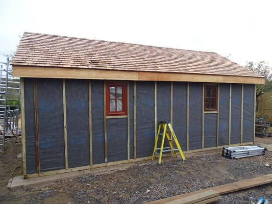 Work is progressing on our latest #rustic_building #gardenroom.
The windows are fitted, The roof is completed with #Cedarshingles.
Larch floorboards are being fixed.and the walls are ready for the waney edged Larch boards. The studwork is #English_timber too.