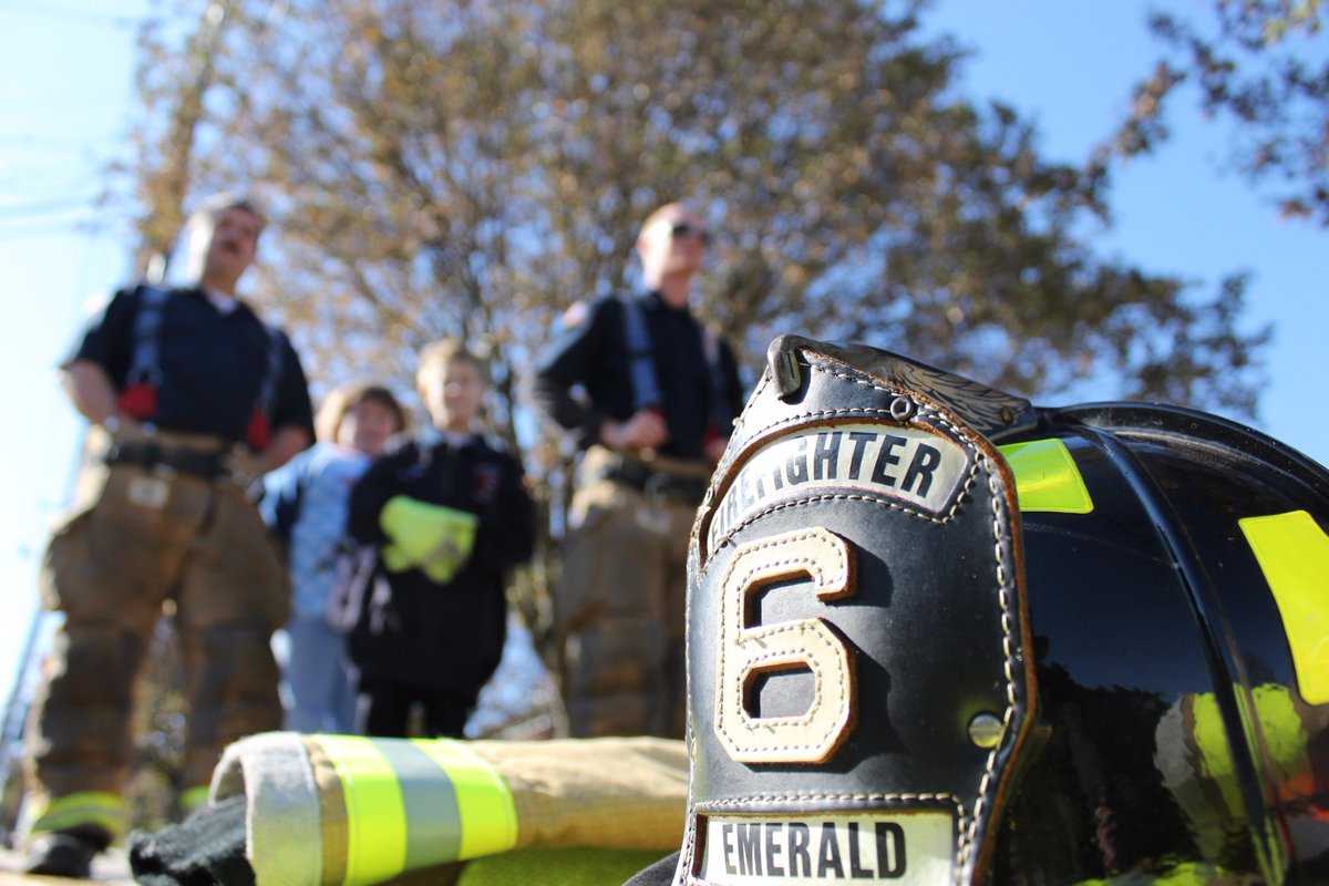 Firefighters from around the region watch as a procession of first responders drive by St. Luke's Fountain Hill for <a href="/PAStatePolice/">PA State Police</a> trooper Cpl. Seth Kelly on Sunday, Nov. 12, 2017.